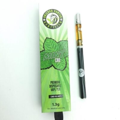 A green and black e-cigarette with a mint leaf symbolizing flavor choices between dry Herb vs Oil Vape pen.